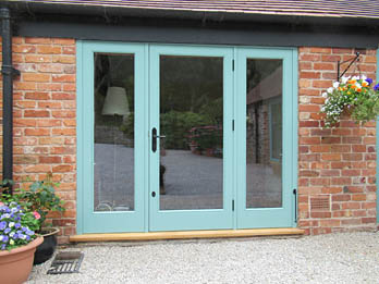 Painted hardwood door with fixed glazed panels either side, handmade in Shropshire